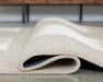 Wolbert 7'8" x 10' Area Rug - FAMSA Furniture (TX)